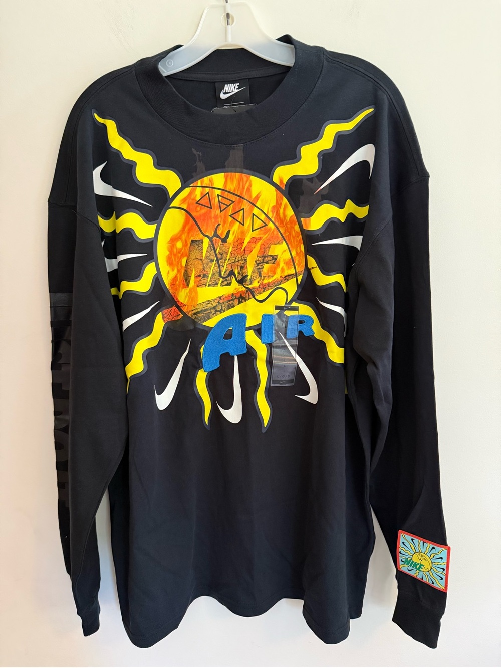 Nike Black Long Sleeve Tee with Yellow Sunburst and Blue 'Air' Graphic